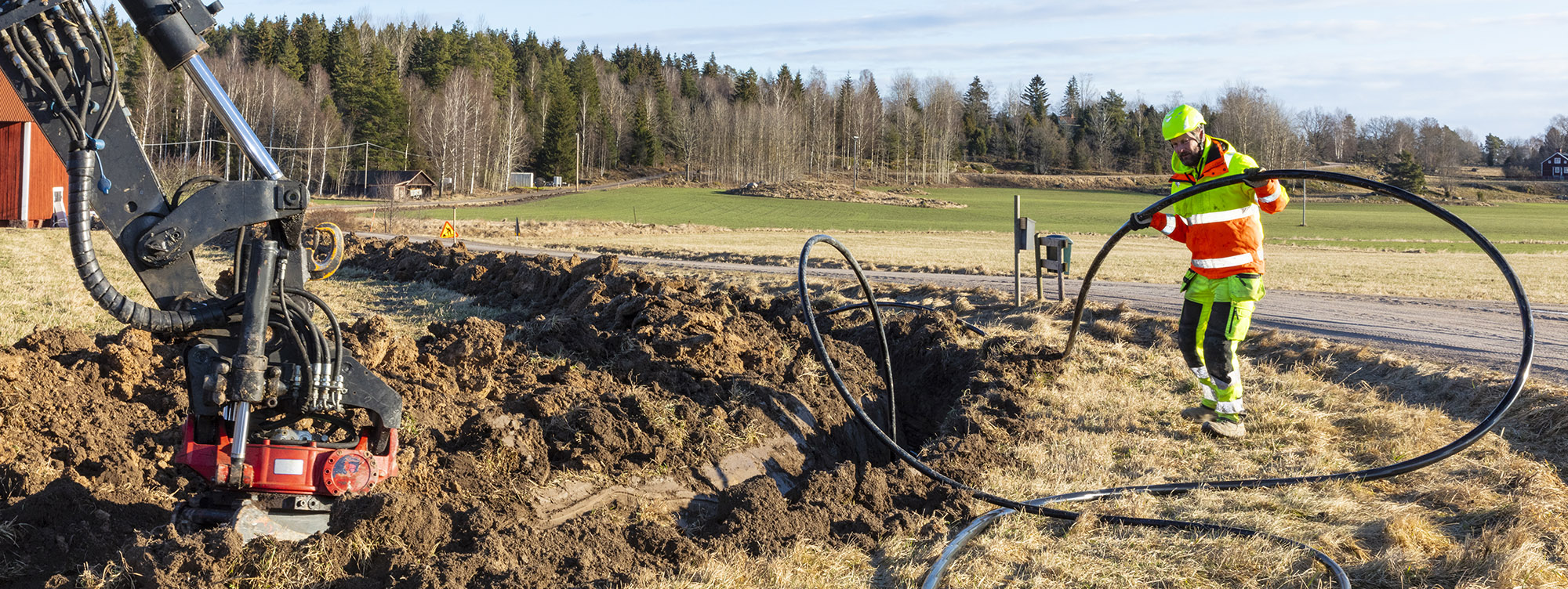 worker installing unground cable